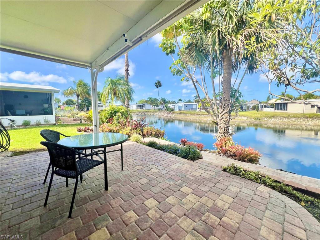 273 Cape Sable Drive Naples, FL 34104 - Photo 29 of 49 a view of a swimming pool with a lounge chairs