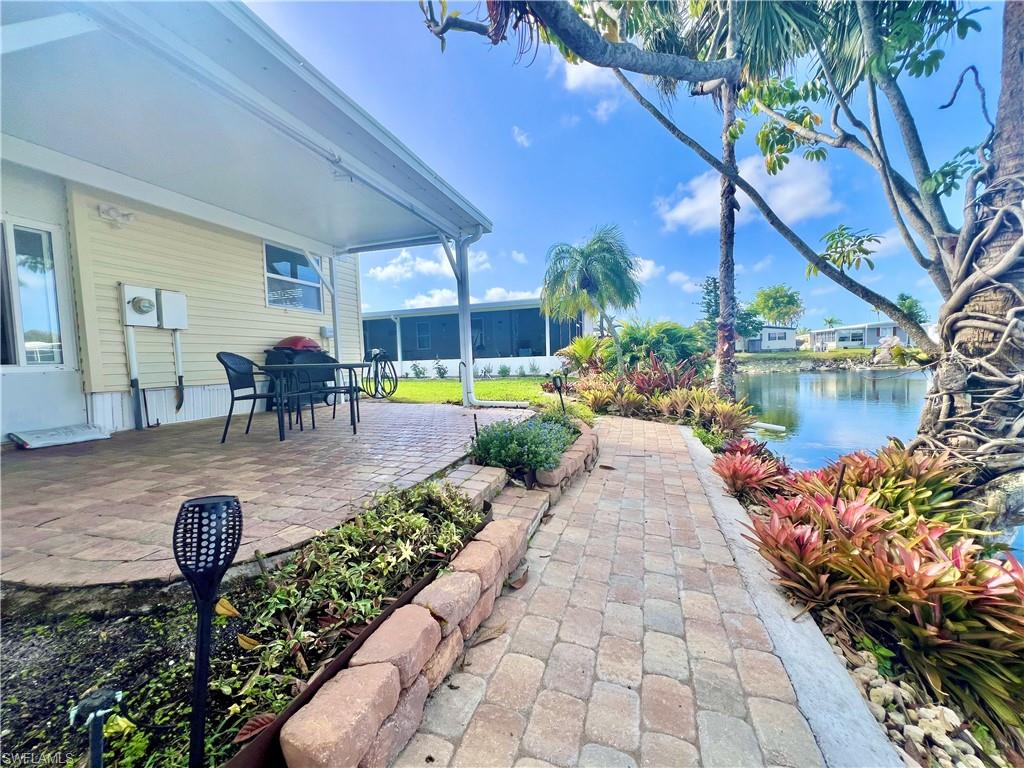 273 Cape Sable Drive Naples, FL 34104 - Photo 32 of 49 a view of a swimming pool with a patio