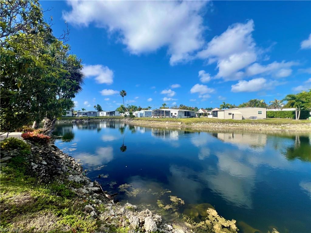 273 Cape Sable Drive Naples, FL 34104 - Photo 36 of 49 a view of a lake with outside house