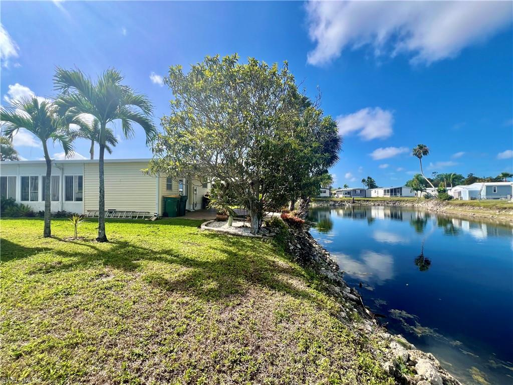 273 Cape Sable Drive Naples, FL 34104 - Photo 37 of 49 a view of a lake with houses