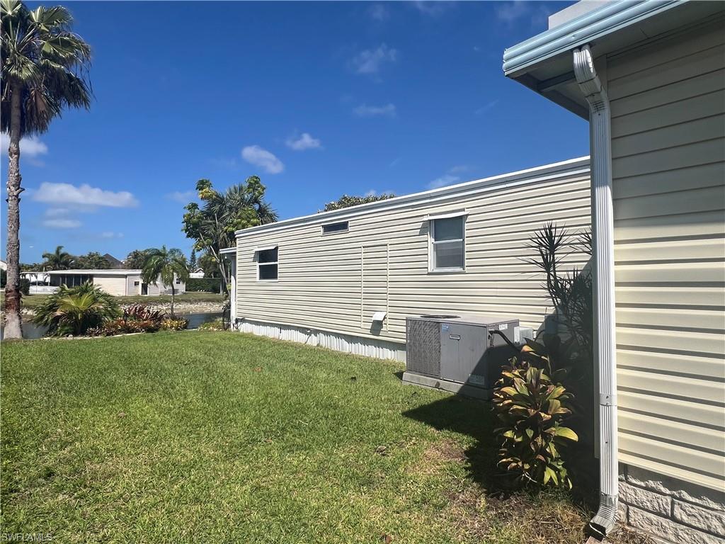 273 Cape Sable Drive Naples, FL 34104 - Photo 42 of 49 a view of a house with a backyard