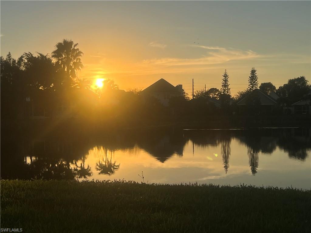 273 Cape Sable Drive Naples, FL 34104 - Photo 44 of 49 a view of a lake in a sunset