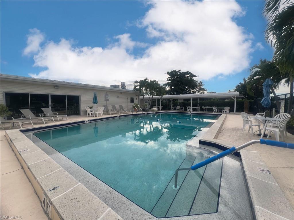 273 Cape Sable Drive Naples, FL 34104 - Photo 48 of 49 a view of a swimming pool with a patio