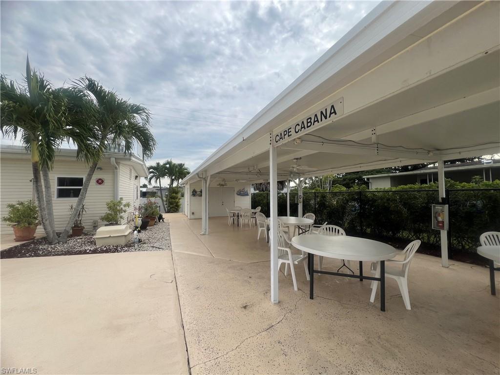 273 Cape Sable Drive Naples, FL 34104 - Photo 49 of 49 a building outdoor space with patio furniture and potted plants