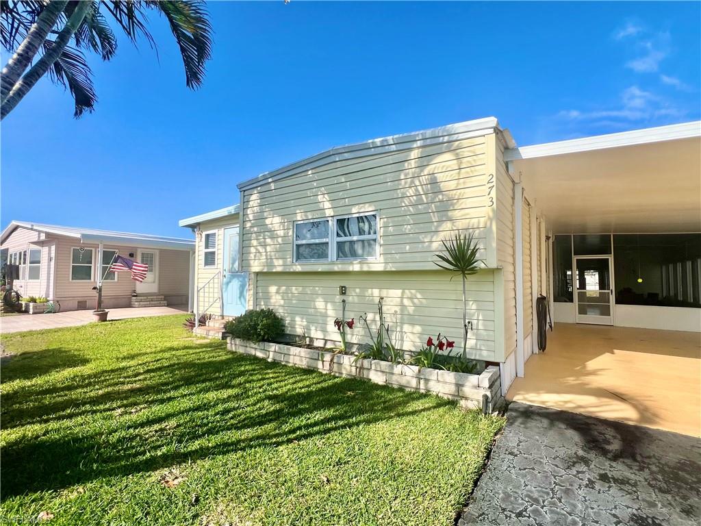 273 Cape Sable Drive Naples, FL 34104 - Photo 5 of 49 a view of a house with backyard porch and sitting area