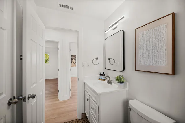 a bathroom with a sink a mirror and a shower