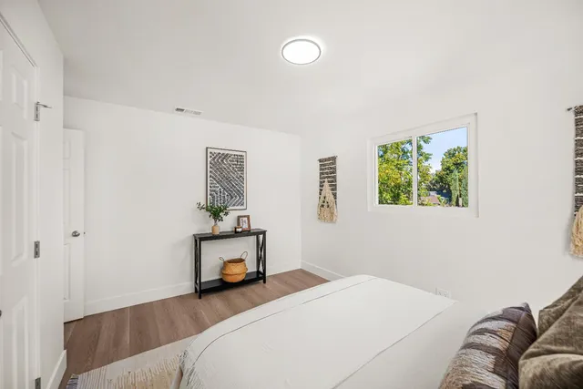 a bedroom with a bed and window