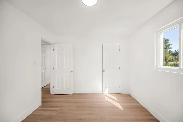 a view of an empty room and window