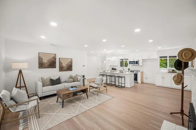a living room with furniture and a table