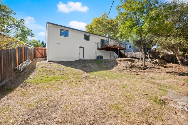 a view of a backyard of the house