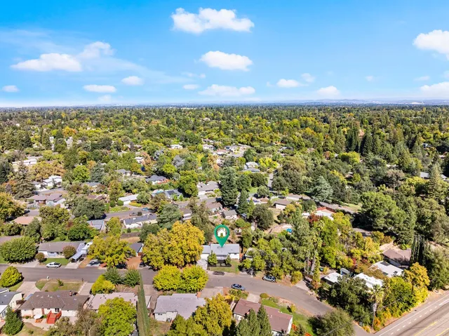an aerial view of residential houses with outdoor space