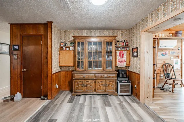 a view of livingroom with furniture and workspace