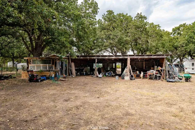 a view of a house with car parked in front of house