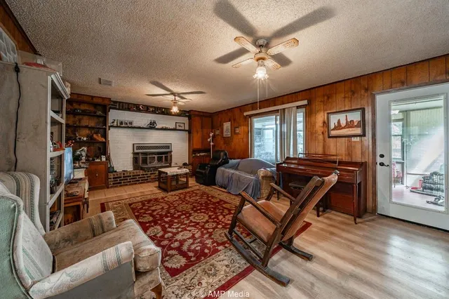 a living room with furniture and a fireplace