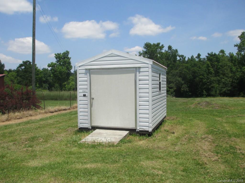 4091 Flat Creek Road Lancaster, SC 29720 - Photo 15 of 19 a view of a backyard with barn