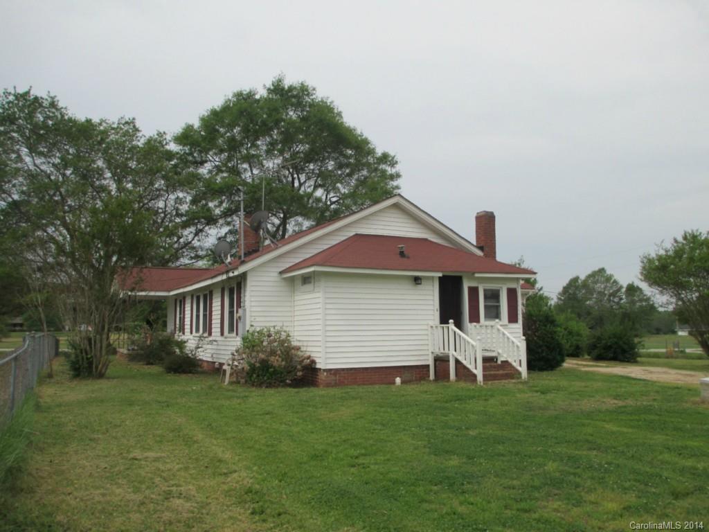 4091 Flat Creek Road Lancaster, SC 29720 - Photo 18 of 19 a front view of a house with a garden
