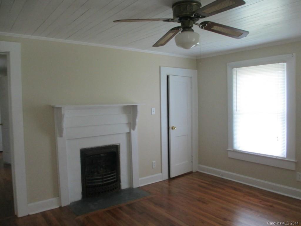 4091 Flat Creek Road Lancaster, SC 29720 - Photo 3 of 19 a view of an empty room with a fireplace and a window