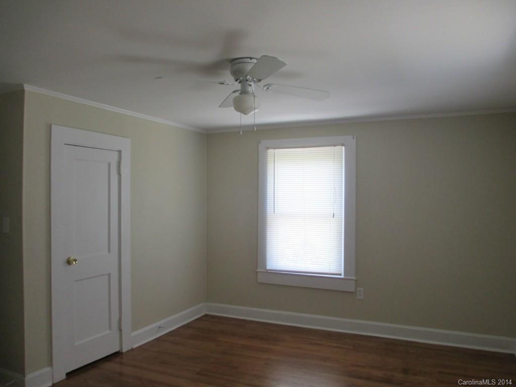 4091 Flat Creek Road Lancaster, SC 29720 - Photo 5 of 19 an empty room with wooden floor closet and windows