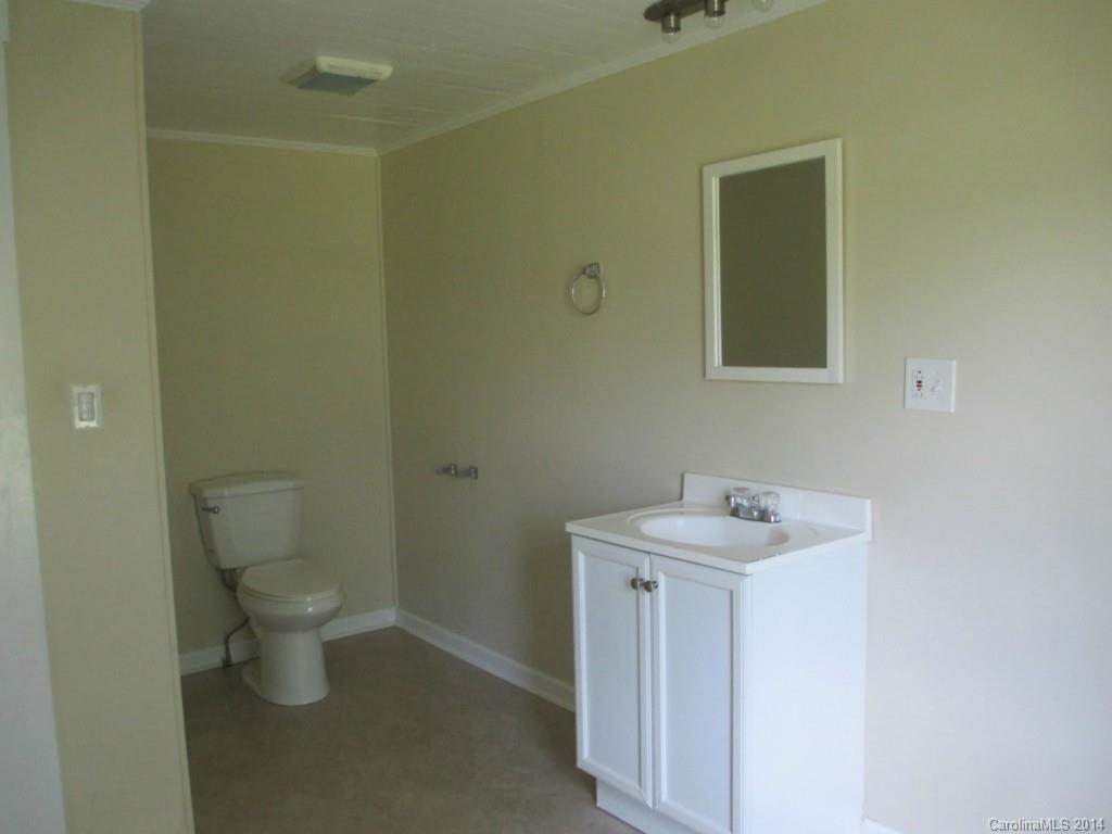 4091 Flat Creek Road Lancaster, SC 29720 - Photo 9 of 19 a bathroom with a toilet sink and mirror