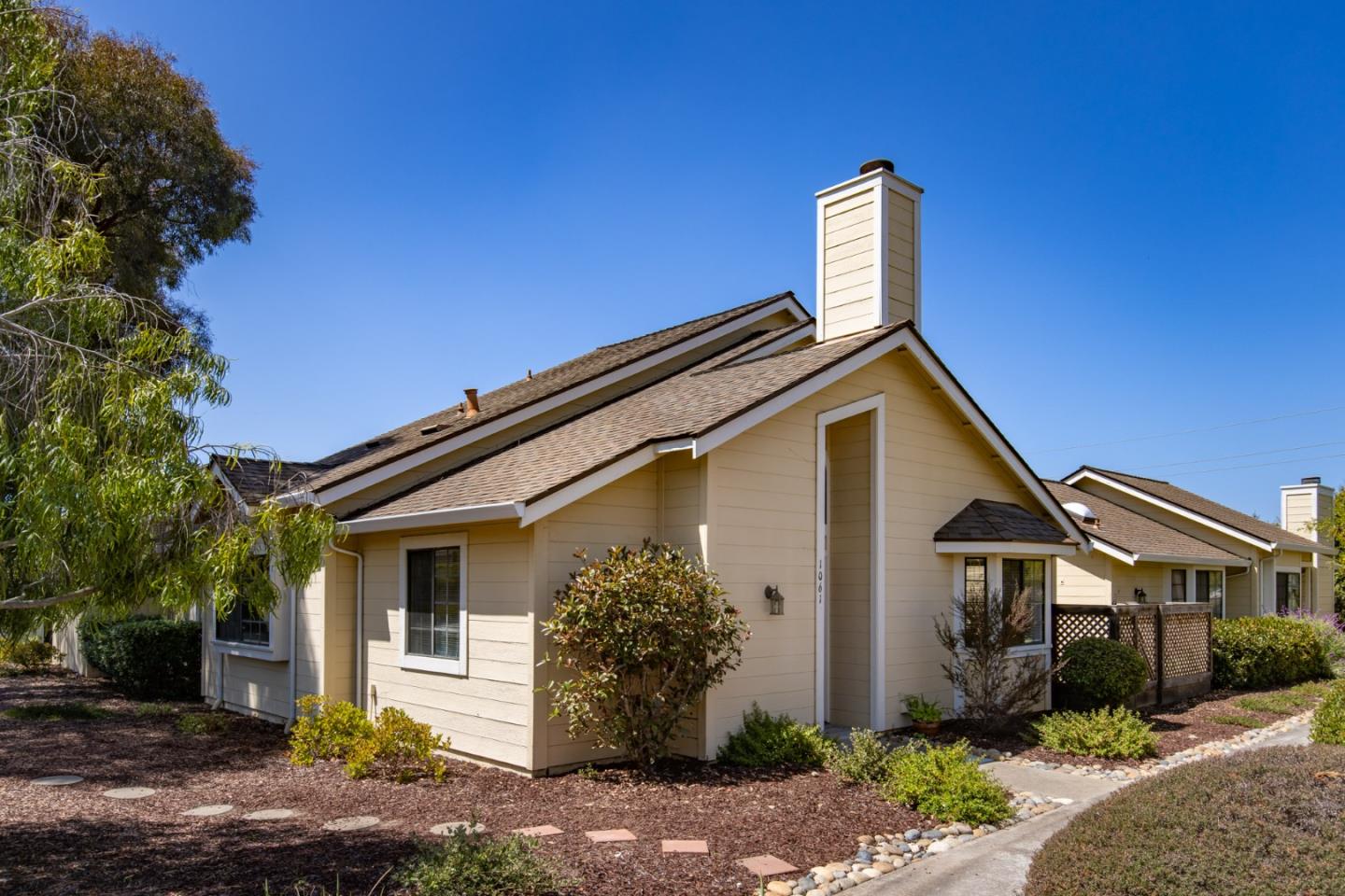 1061 Olympic Lane Seaside, CA 93955 - Photo 20 of 24 a front view of a house with garden