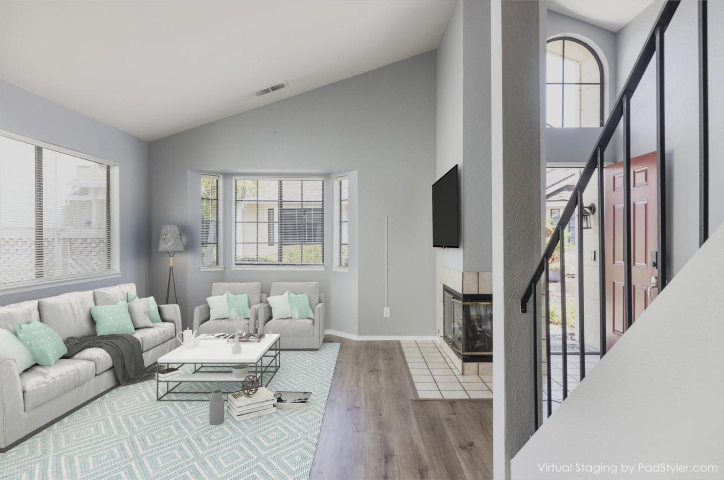 1061 Olympic Lane Seaside, CA 93955 - Photo 4 of 24 a living room with furniture fireplace and a flat screen tv