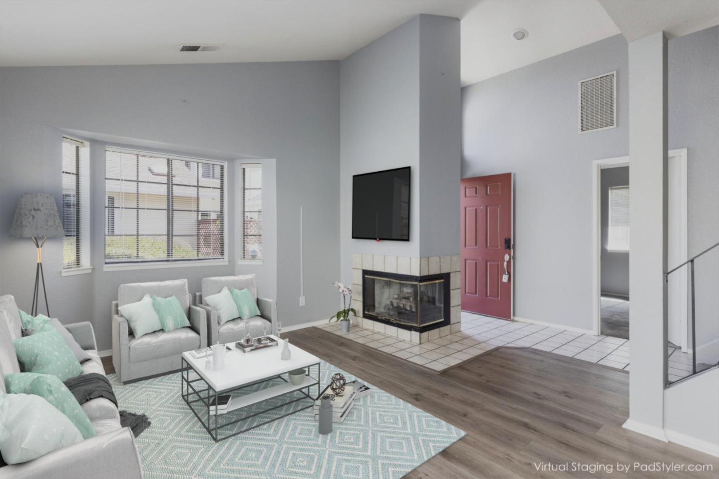 1061 Olympic Lane Seaside, CA 93955 - Photo 5 of 24 a living room with furniture a flat screen tv and a large window
