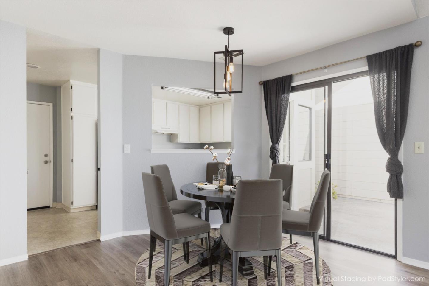 1061 Olympic Lane Seaside, CA 93955 - Photo 7 of 24 a view of a dining room with furniture window and wooden floor