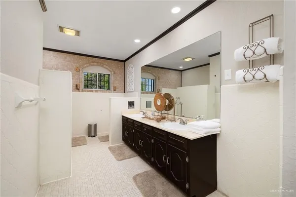 a kitchen with a sink cabinets and window