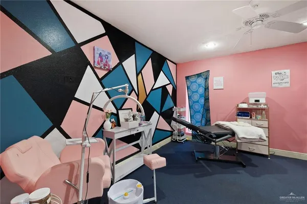 a room with furniture and air hockey table