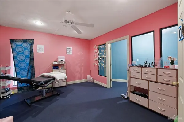 a bed room with a bed and a dresser