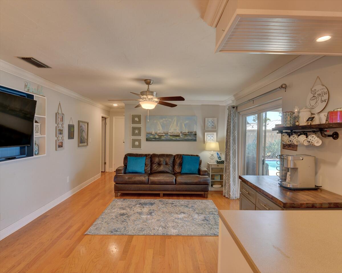 365 Kingston Road Satellite Beach, FL 32937 - Photo 15 of 31 a living room with stainless steel appliances granite countertop furniture and fireplace