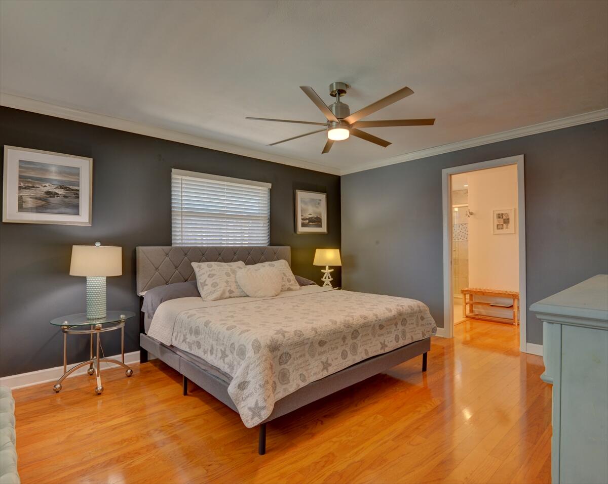 365 Kingston Road Satellite Beach, FL 32937 - Photo 17 of 31 a bedroom with a bed chandelier and a window
