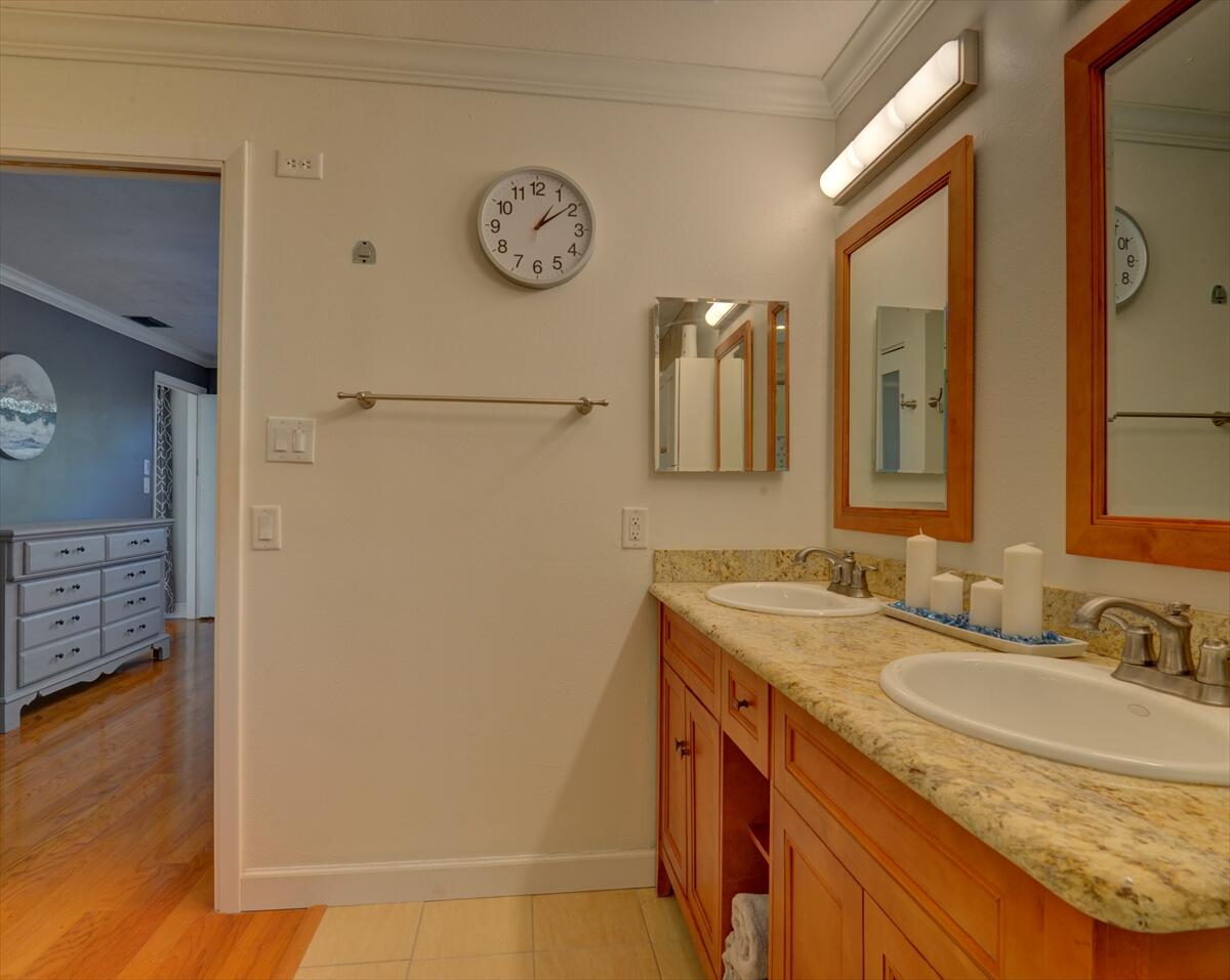 365 Kingston Road Satellite Beach, FL 32937 - Photo 21 of 31 a bathroom with a granite countertop sink a mirror and a shower