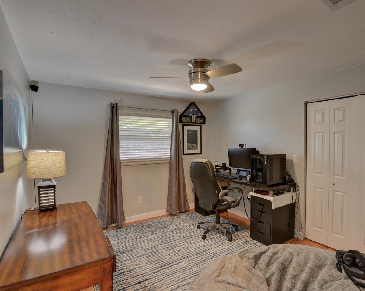 365 Kingston Road Satellite Beach, FL 32937 - Photo 24 of 31 a view of a workspace with furniture and a window