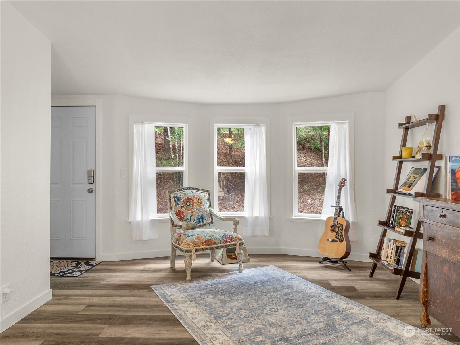 1400 West Deegan Road West Shelton, WA 98584 - Photo 13 of 40 a living room with furniture a fireplace and large windows