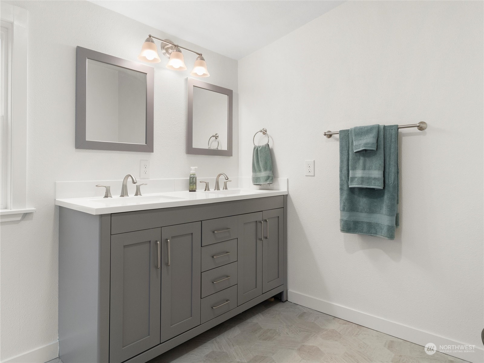1400 West Deegan Road West Shelton, WA 98584 - Photo 20 of 40 a bathroom with a double vanity sink and mirror