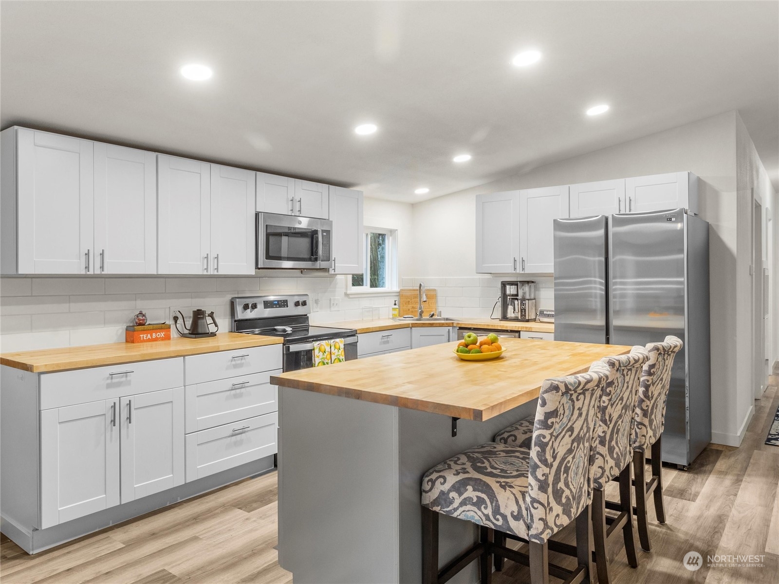 1400 West Deegan Road West Shelton, WA 98584 - Photo 2 of 40 a kitchen with stainless steel appliances granite countertop a table chairs sink refrigerator and cabinets