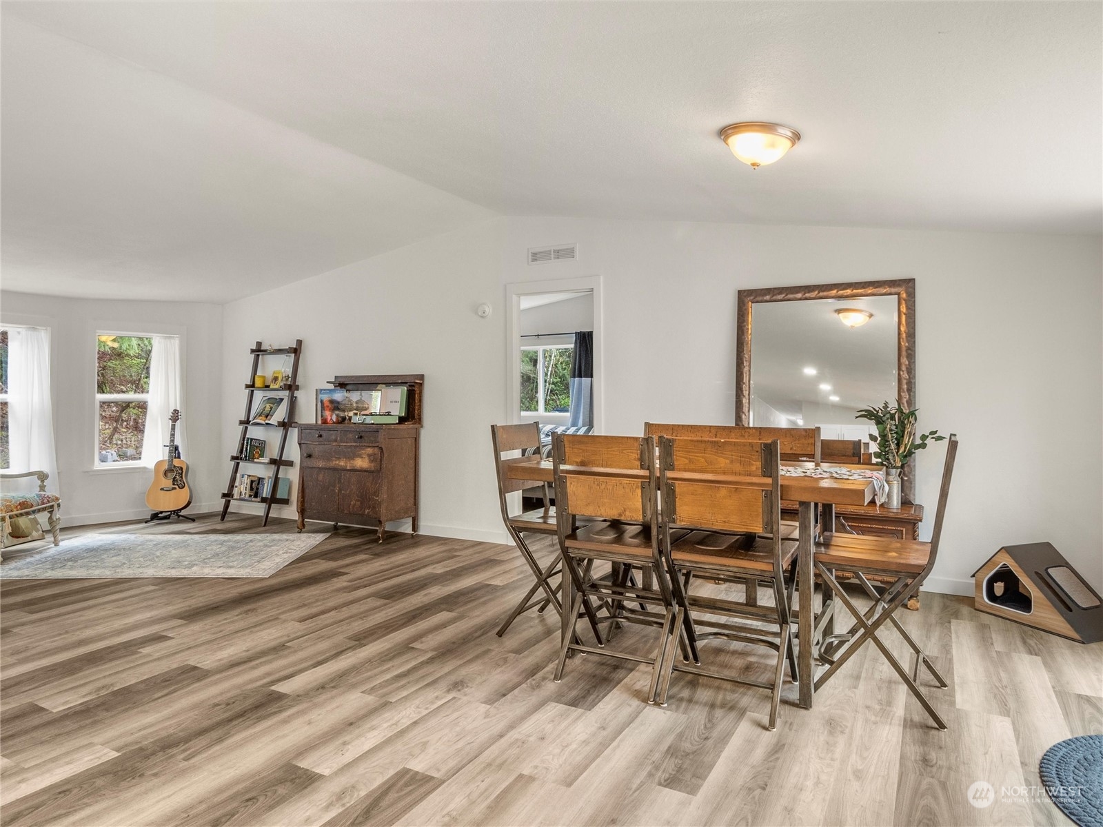 1400 West Deegan Road West Shelton, WA 98584 - Photo 7 of 40 a view of a dining room with furniture and wooden floor