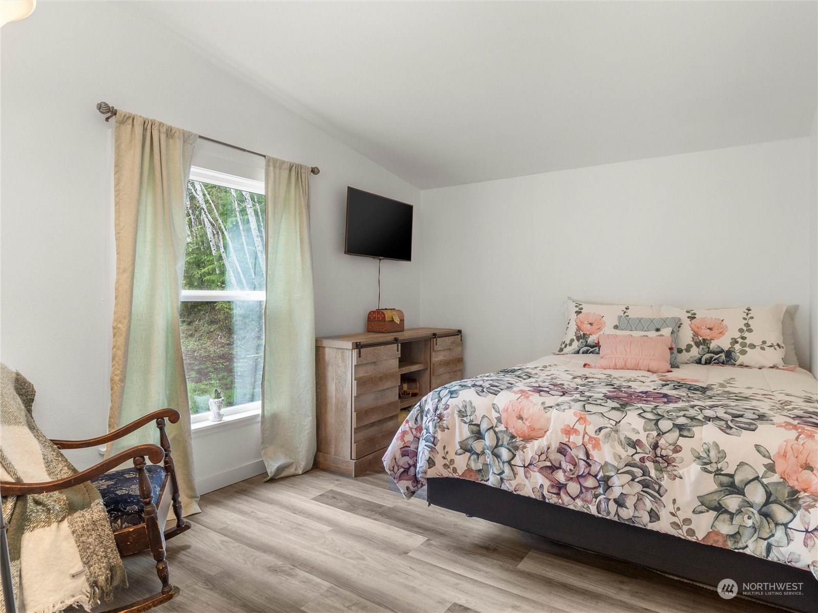 1400 West Deegan Road West Shelton, WA 98584 - Photo 9 of 40 a bedroom with a bed a flat screen tv and a window