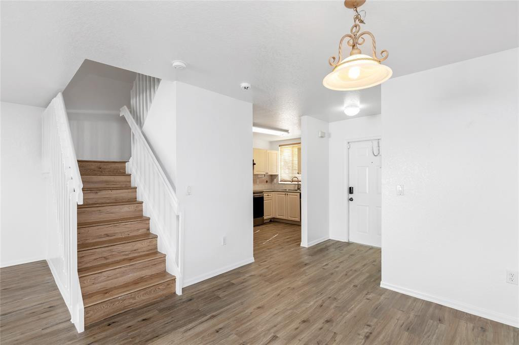 159 Hidden Ct Road, Unit I49 Hollywood, FL 33023 - Photo 7 of 21 a view of a hallway with wooden floor and entryway