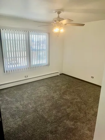 an empty room with a empty space and windows