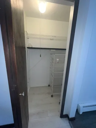 a bathroom with a glass door shower