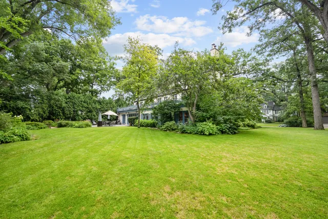 a view of house with backyard