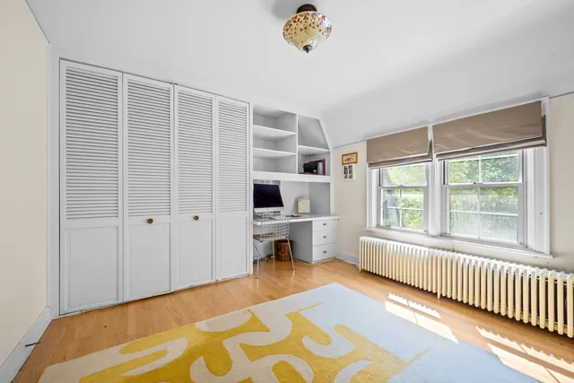 a reading room with furniture and rug