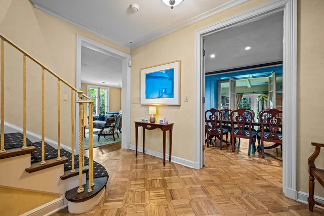 a living room with furniture and large windows