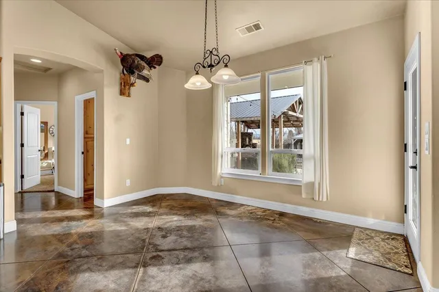 a view of a livingroom with a ceiling fan and window