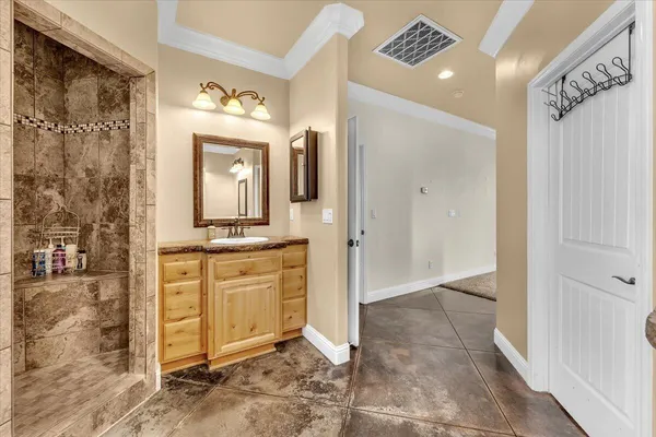 a bathroom with a toilet a sink and a mirror