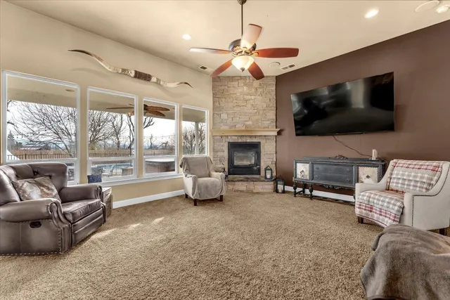 a kitchen with stainless steel appliances granite countertop a stove a sink and cabinets