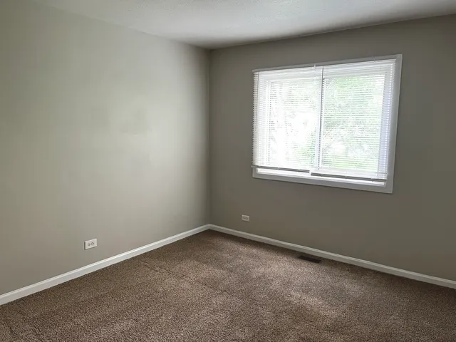 a bedroom with bed and furniture