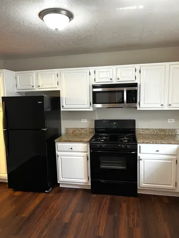 a bathroom with a sink a toilet and a bathtub